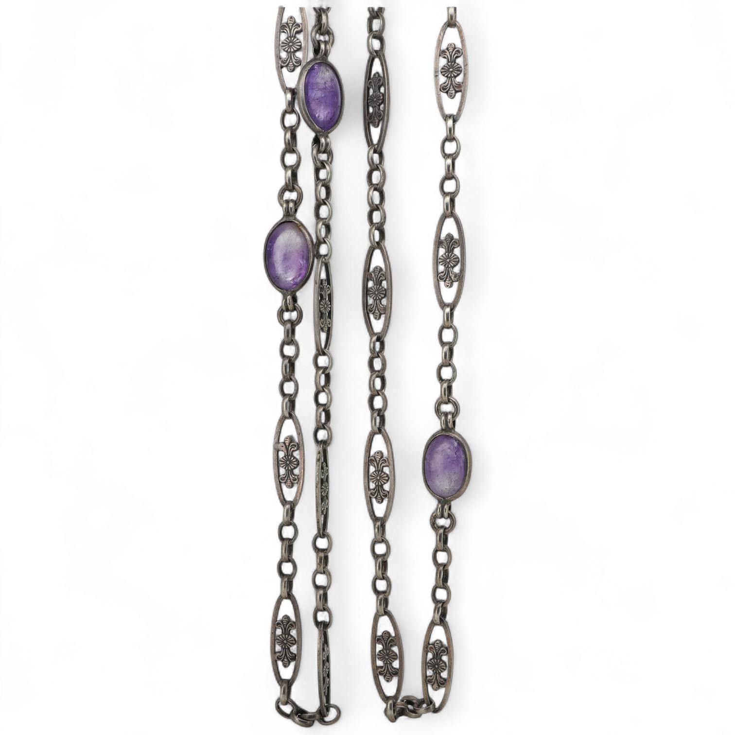 A late 19th/early 20th century silver and amethyst longchain, composed of foliate links and set with cabochon amethysts, length 150cm, stamped 800, maker's mark HY